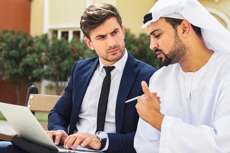 Business executive having a conversation with an Arabian businessman